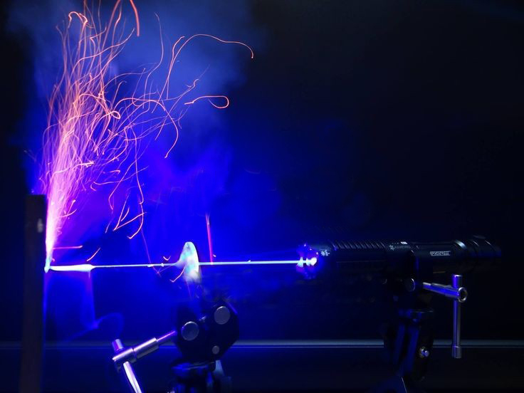 strong powerful laser launch blue beam light